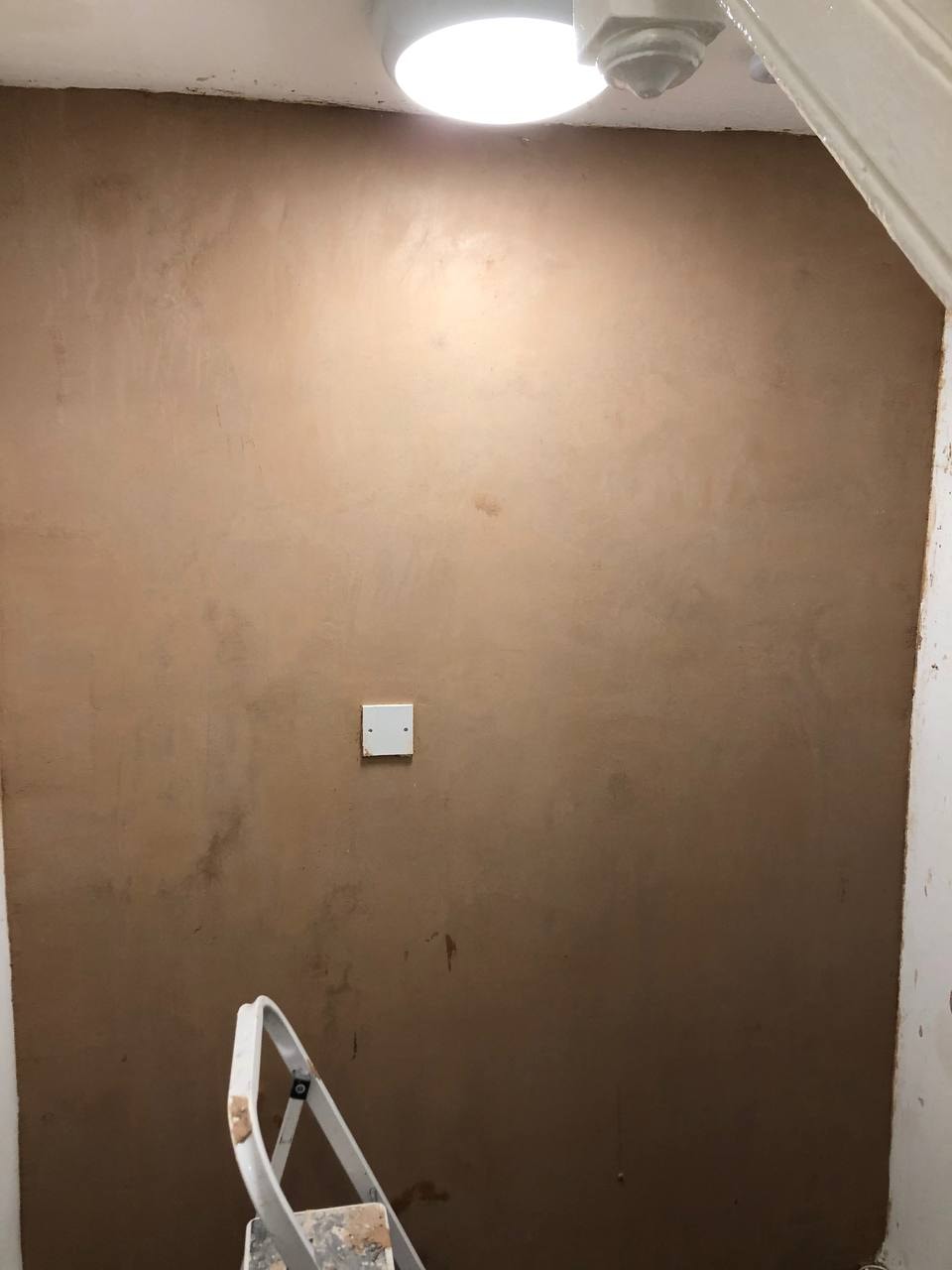 Freshly plastered wall ready for painting — West London